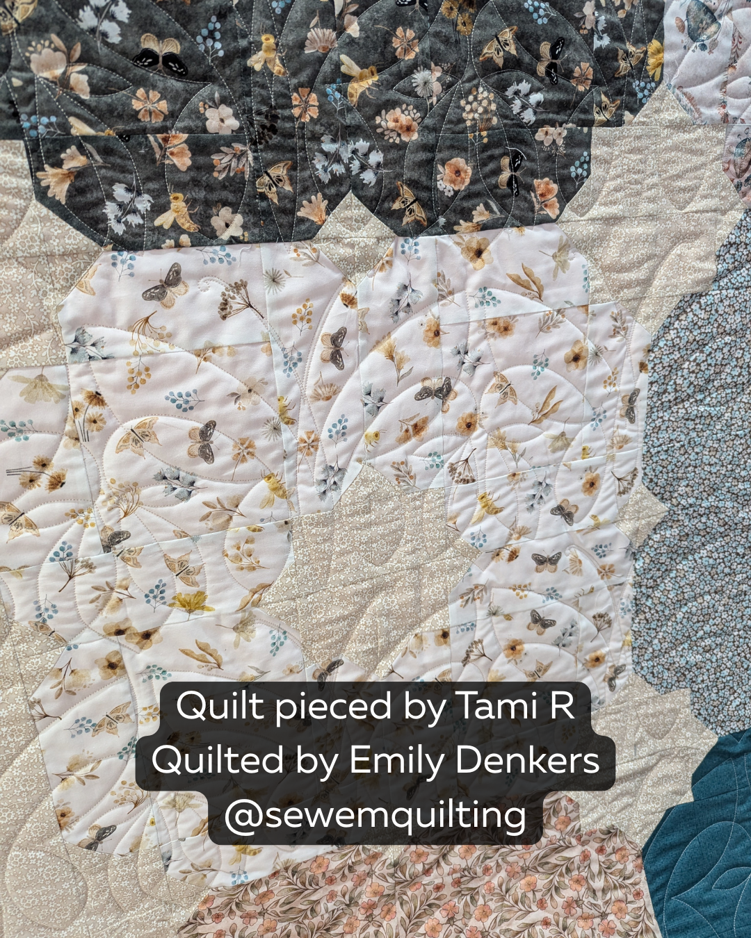 Bella Butterfly longarm butterfly pantograph stitched edge to edge across a floral patchwork quilt in cream, charcoal, teal, and gold.