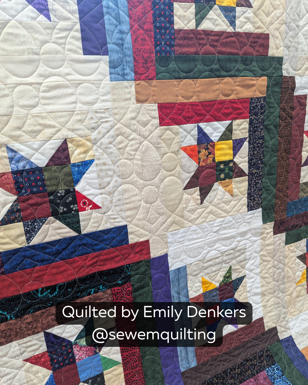 Finished modern patchwork quilt featuring the Business Loop digital quilting pantograph with flowing loops and elegant edge-to-edge stitching