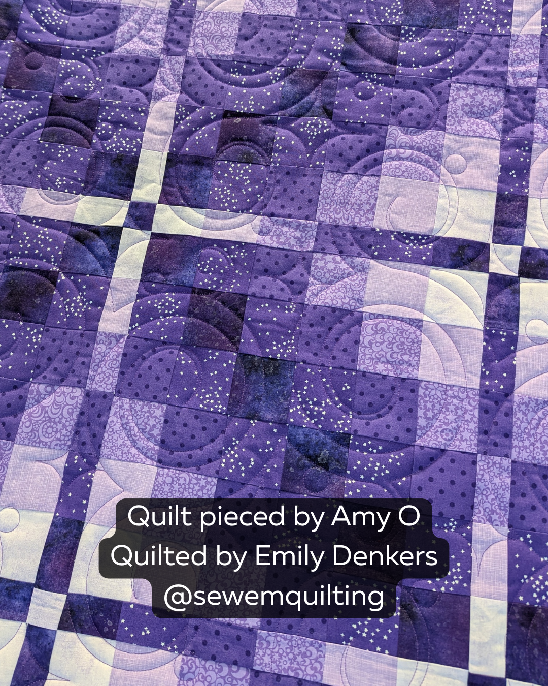 Charming Twinkles digital swirl pantograph stitched across a purple patchwork quilt with flowing curves, loops, and sparkling star fabric details.
