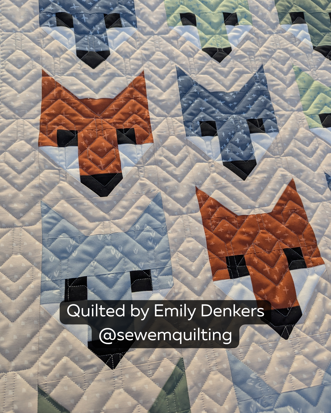 Finished fox quilt featuring the Chevron Shuffle geometric quilting pantograph, with crisp zigzag lines creating playful edge-to-edge longarm quilting texture.