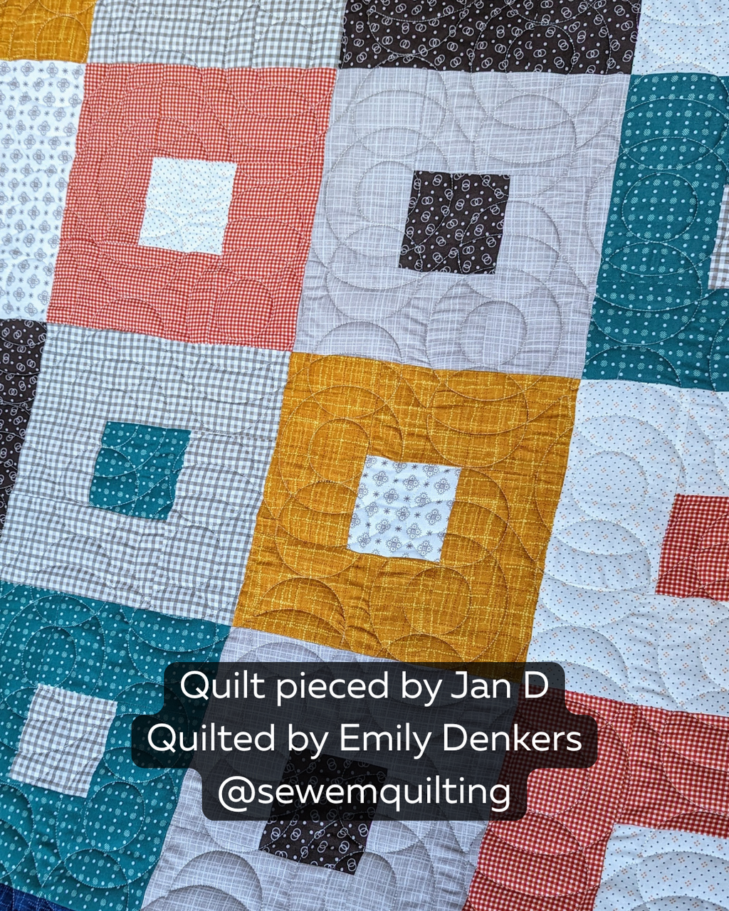 Delusion Optical Illusion pantograph stitched across a modern patchwork quilt with mesmerizing curved lines and geometric illusion effects.