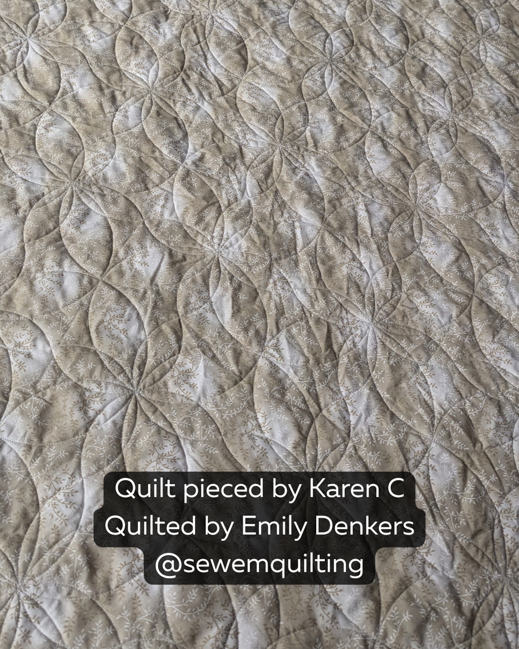 Double Orange Peel geometric flower pantograph quilt design stitched on a neutral fabric quilt, featuring overlapping curved petals and elegant texture.