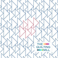 Flankies geometric pantograph design stitched on a modern quilt top, showing how this longarm pantograph creates a bold, architectural triangle texture across the full surface.