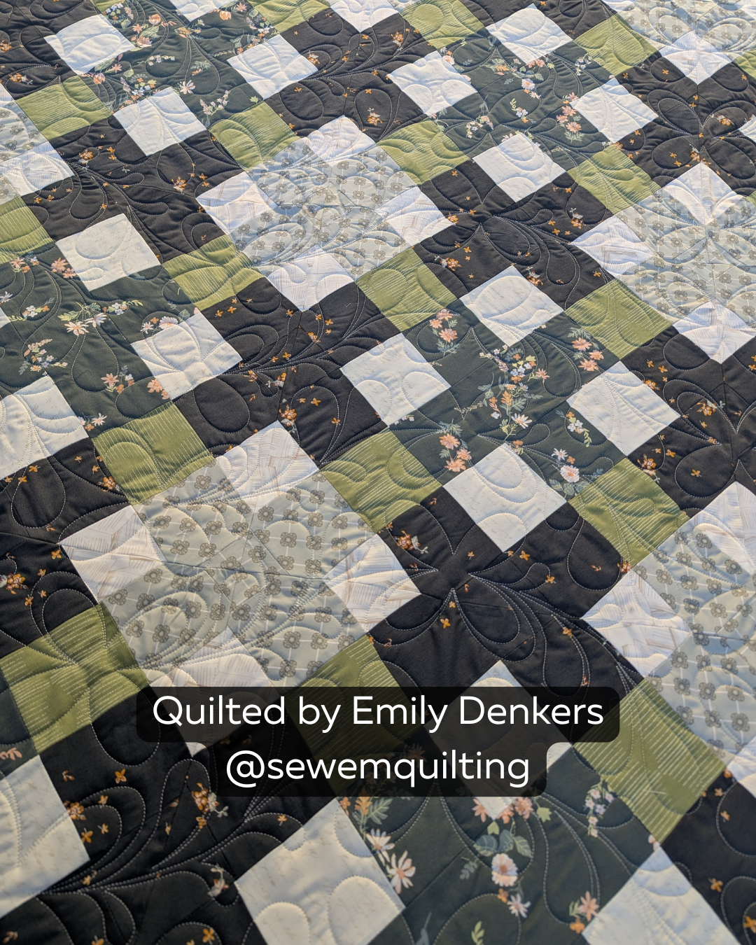 "Finished quilt example using the For Jane floral pantograph, showing looping vine stitching on a green and black patchwork floral quilt, quilted by Emily Denkers @sewemquilting"