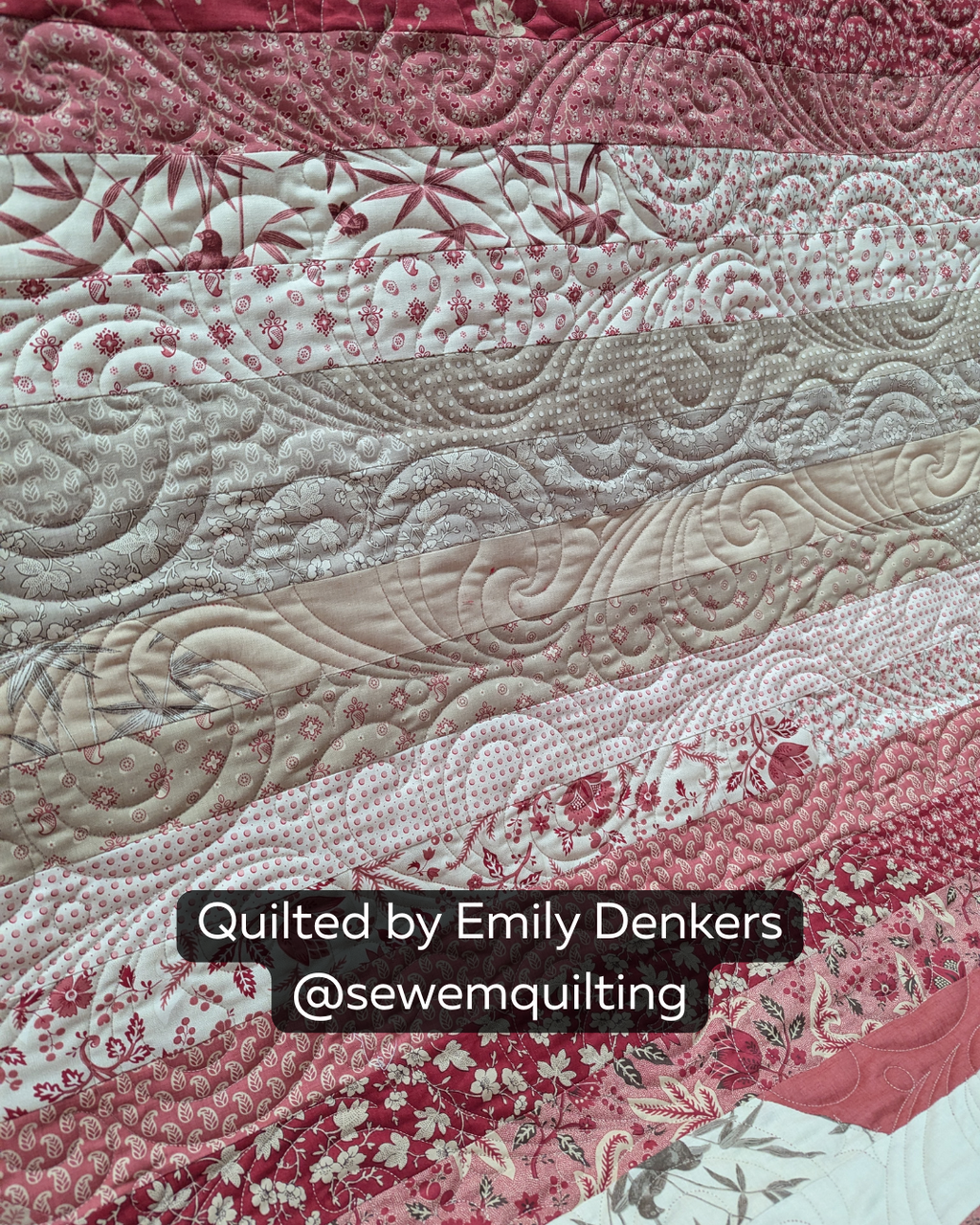 Finished red and cream strip quilt featuring the Glittered Paint Pour digital quilting pantograph with flowing swirls and artistic edge-to-edge texture