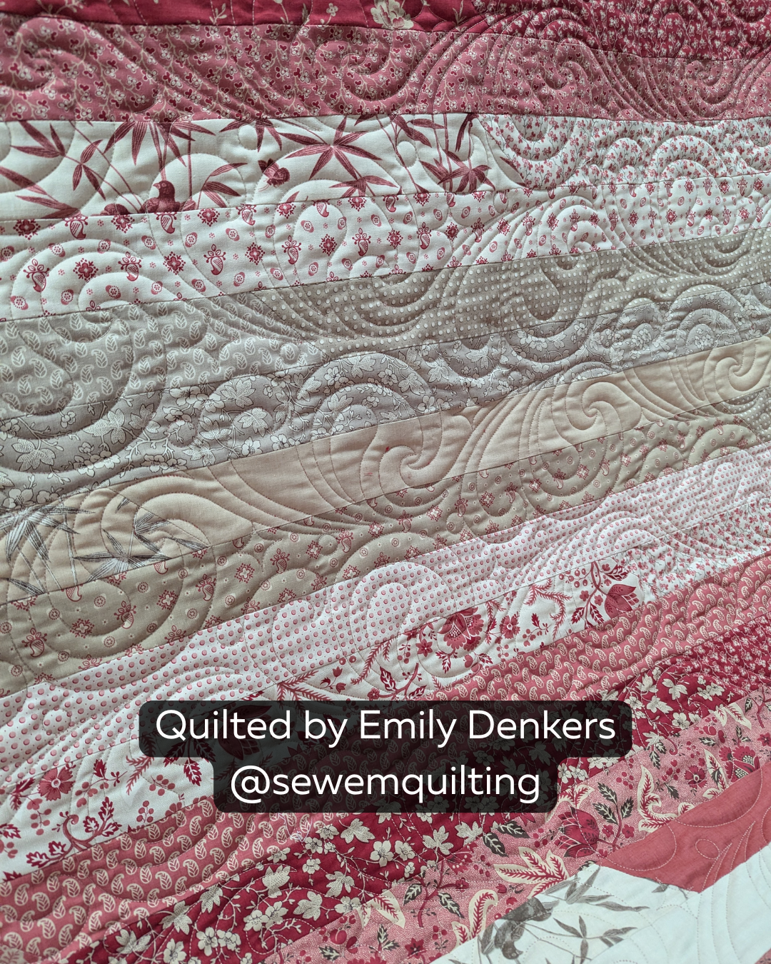 Finished red and cream strip quilt featuring the Glittered Paint Pour digital quilting pantograph with flowing swirls and artistic edge-to-edge texture