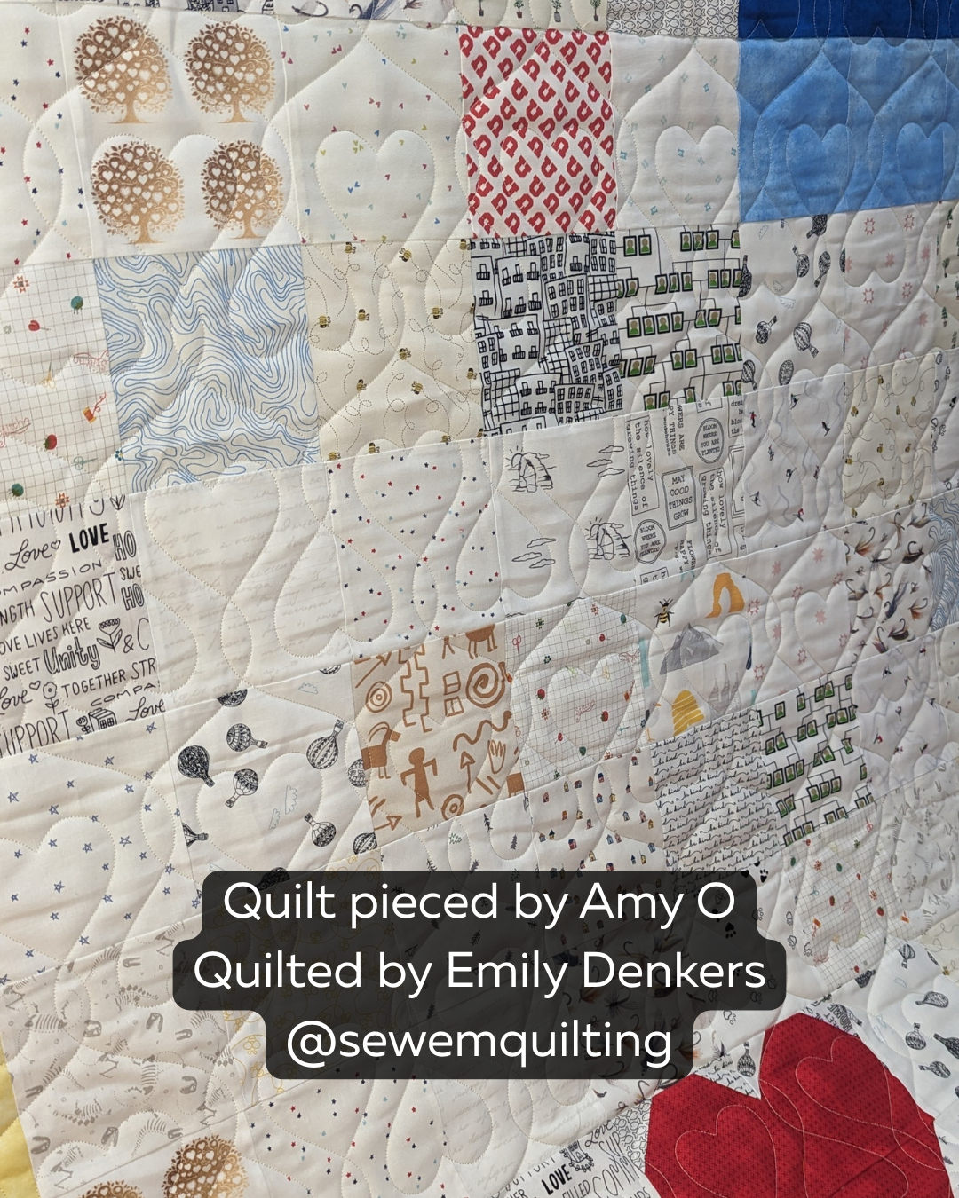 Heart Strings heart quilting pantograph stitched on a modern patchwork quilt, featuring flowing heart motifs and continuous loop designs.