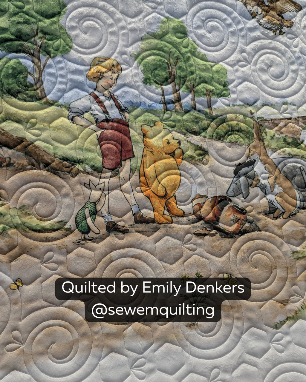 Finished woodland-themed quilt featuring the Honeycomb Swirl quilting pantograph, with spiral hexagons creating playful edge-to-edge texture across the scenic design.