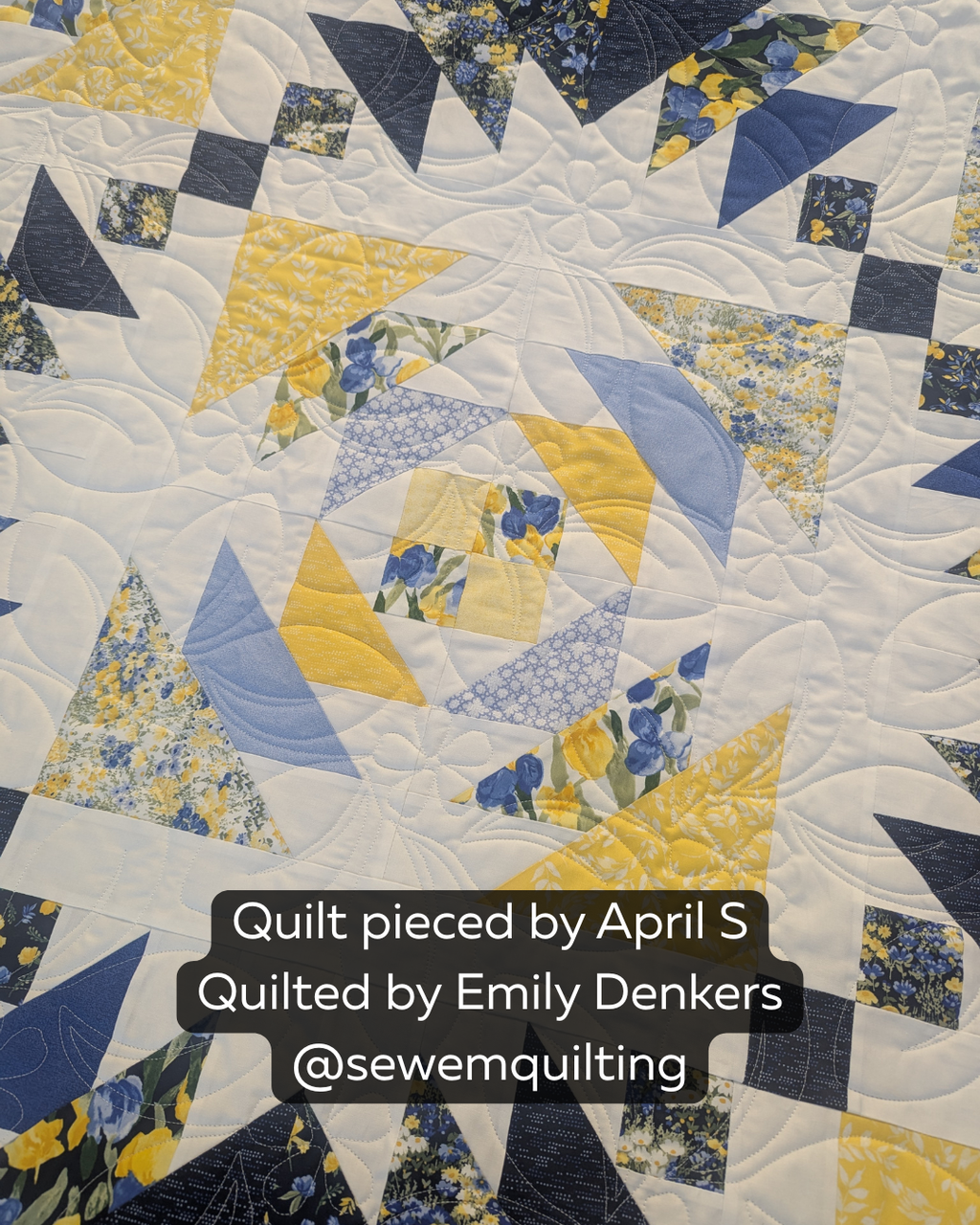 Island Daydream floral pantograph stitched on a modern blue, yellow, and white quilt, featuring flowing floral motifs and elegant longarm quilting texture.