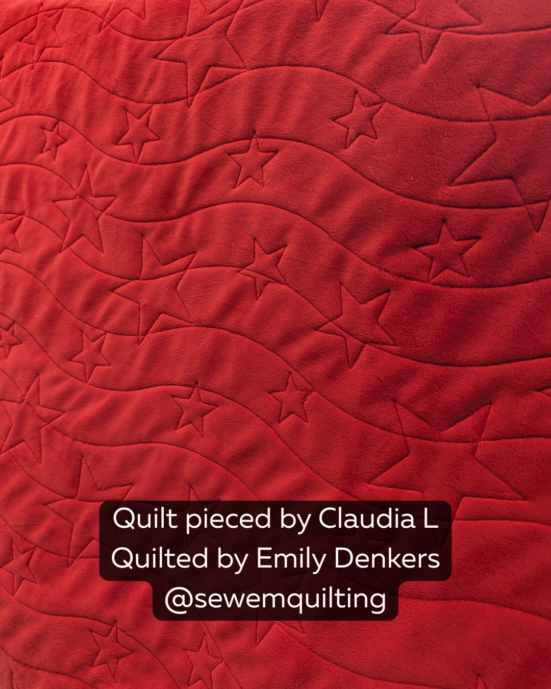 Long May It Wave star longarm pantograph stitched on a bold red quilt with flowing wave texture