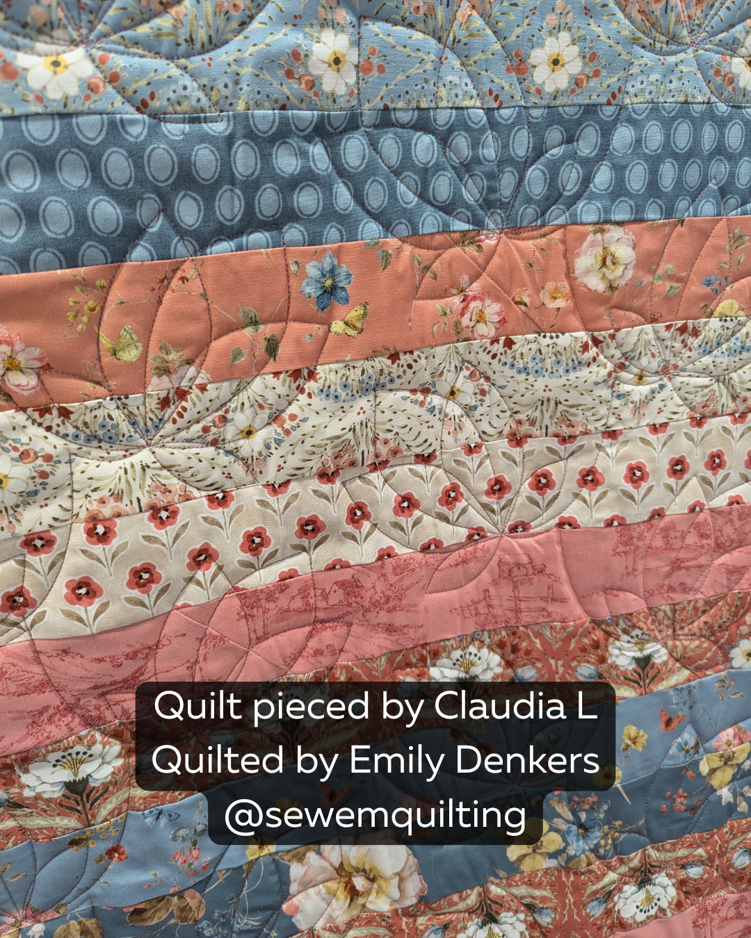 Blue and coral floral quilt with continuous Nodding Bellflower longarm quilting, curved vines and delicate bell-shaped blooms
