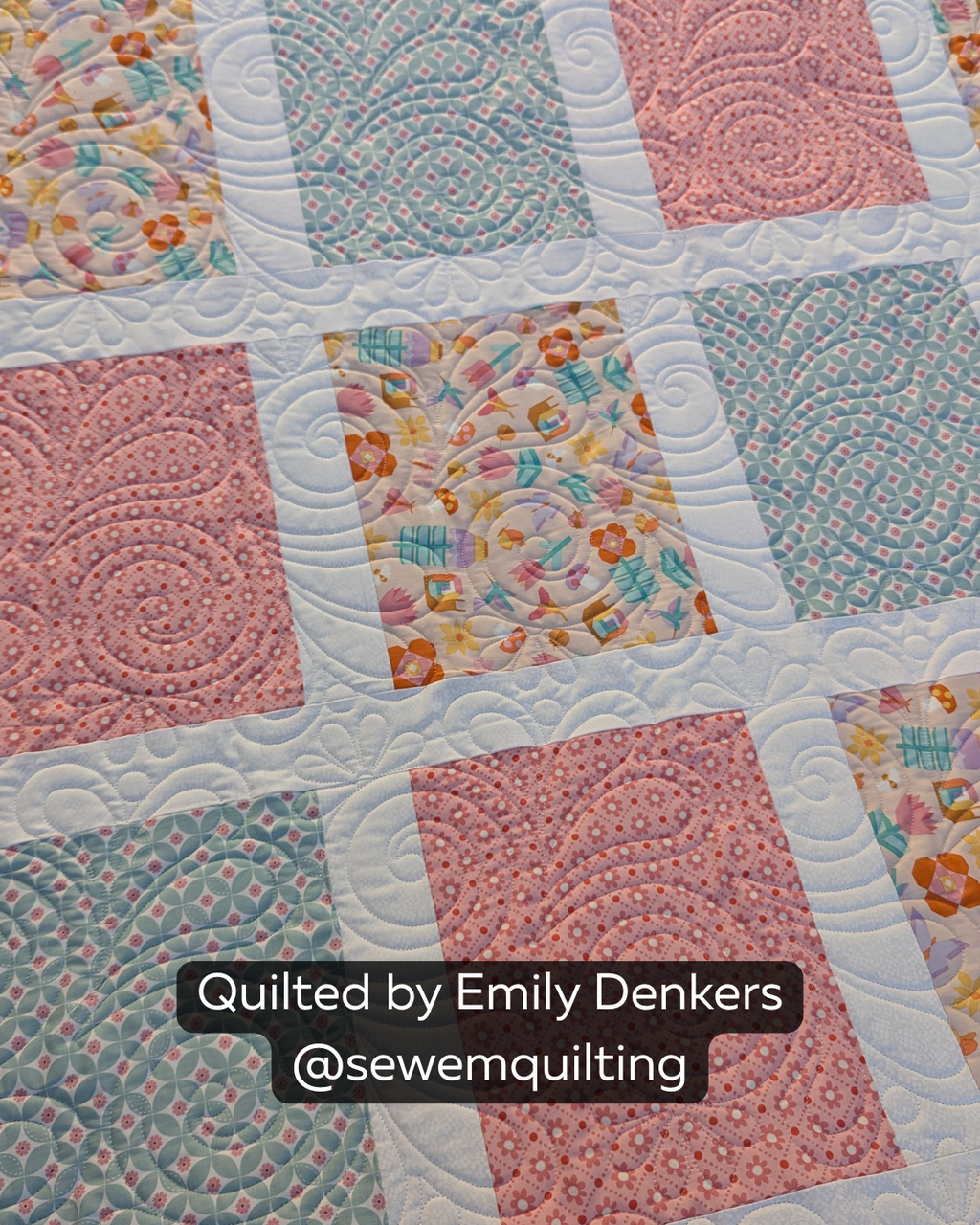 Finished pastel patchwork quilt featuring the Serendipity Floral Swirl digital quilting pantograph with elegant curls and botanical-inspired stitching