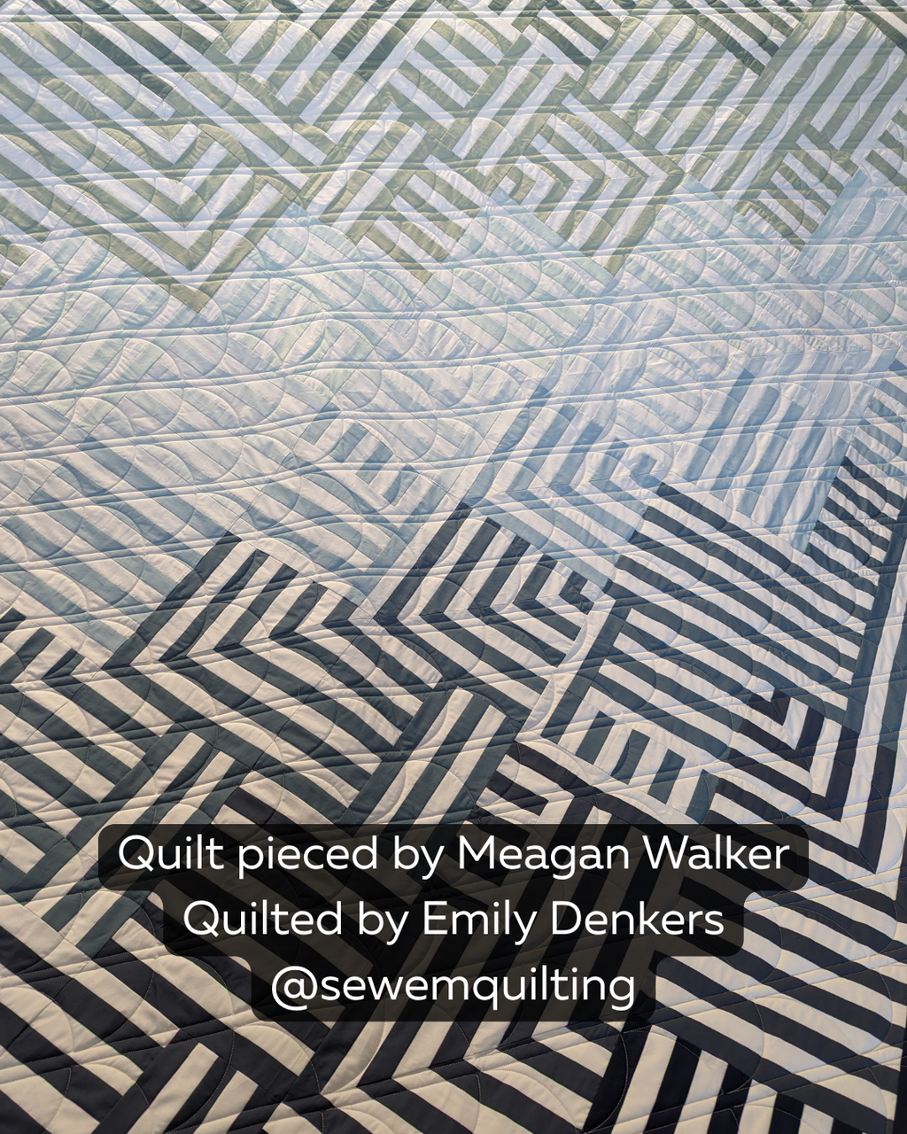 Blue and white geometric quilt stitched with the Sideways Clam 1 pantograph quilting pattern