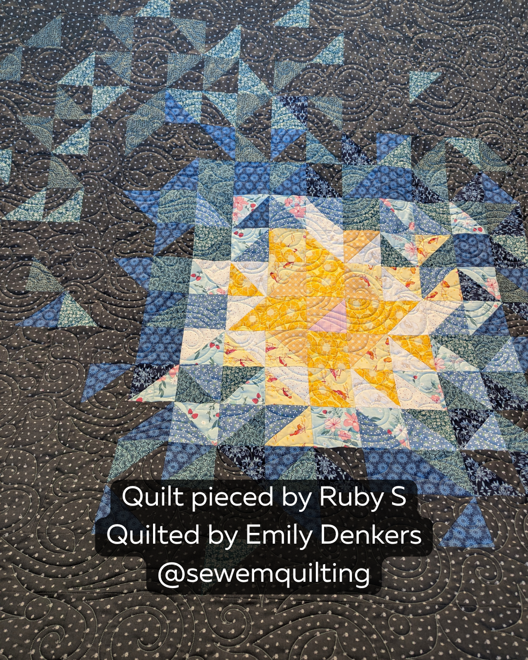 Blue and charcoal star quilt stitched with the Sparkling Dreams star swirl pantograph