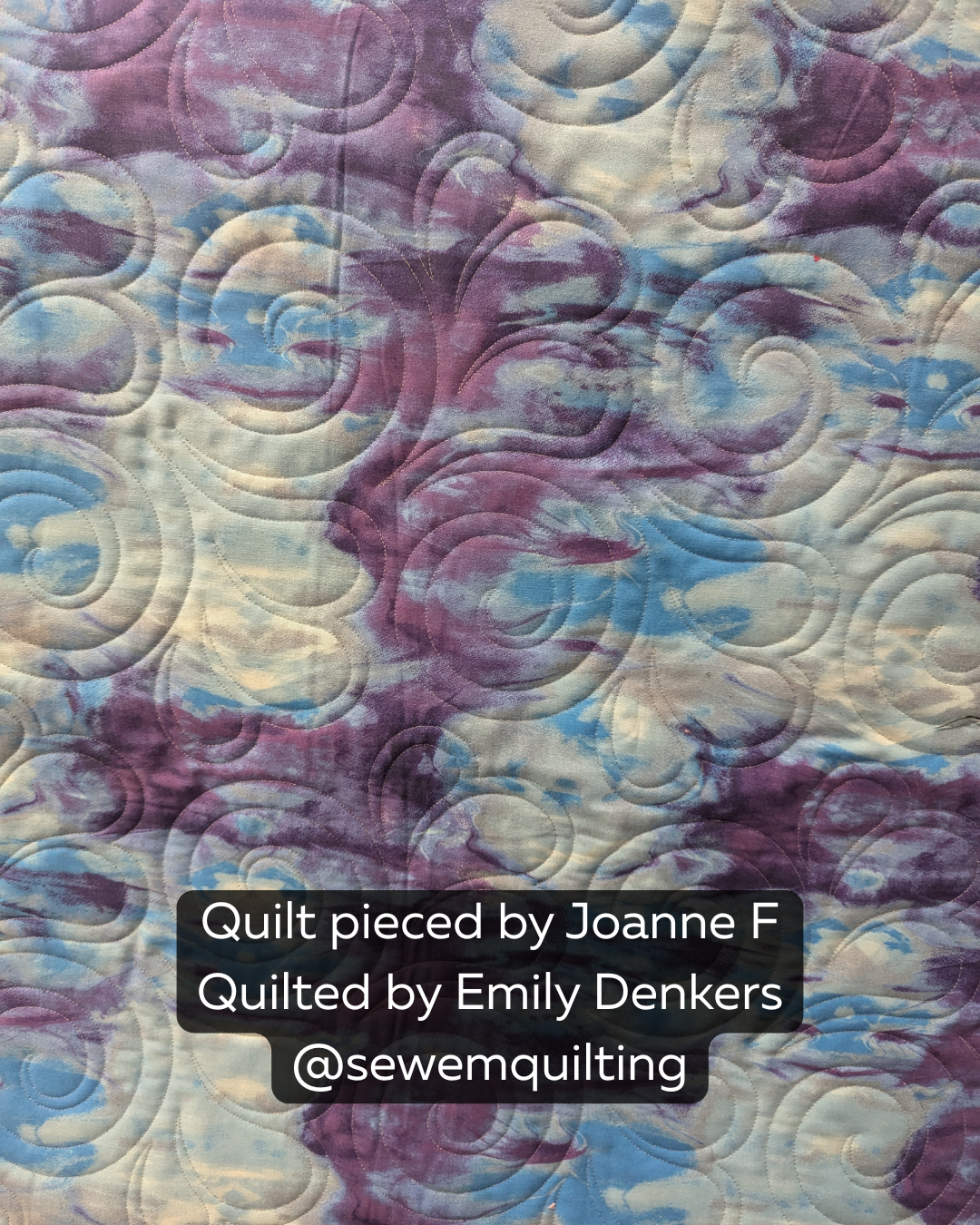 Purple and blue quilt stitched with the Sploosh playful swirl pantograph