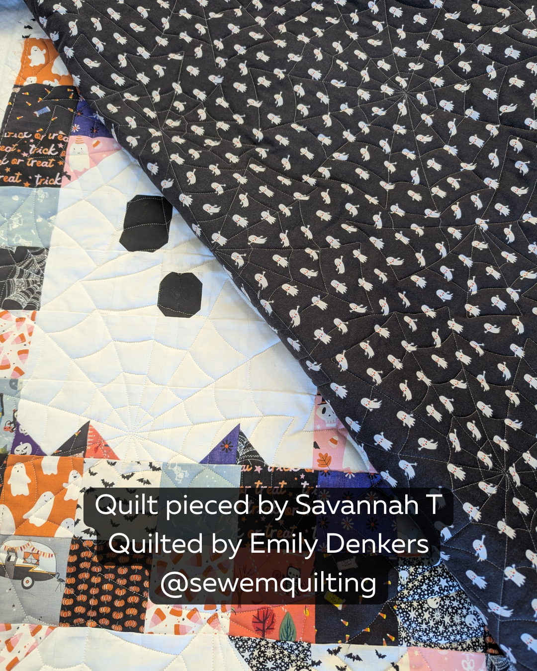 Spooderweb digital pantograph featuring overlapping spiderwebs on a black ghost-print quilt