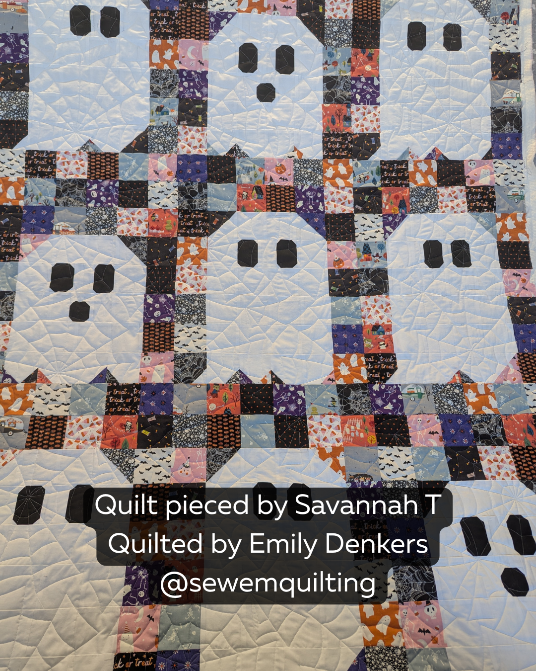 Finished Halloween quilt featuring the Spooderweb digital quilting pantograph with spooky spiderweb details and flowing edge-to-edge texture