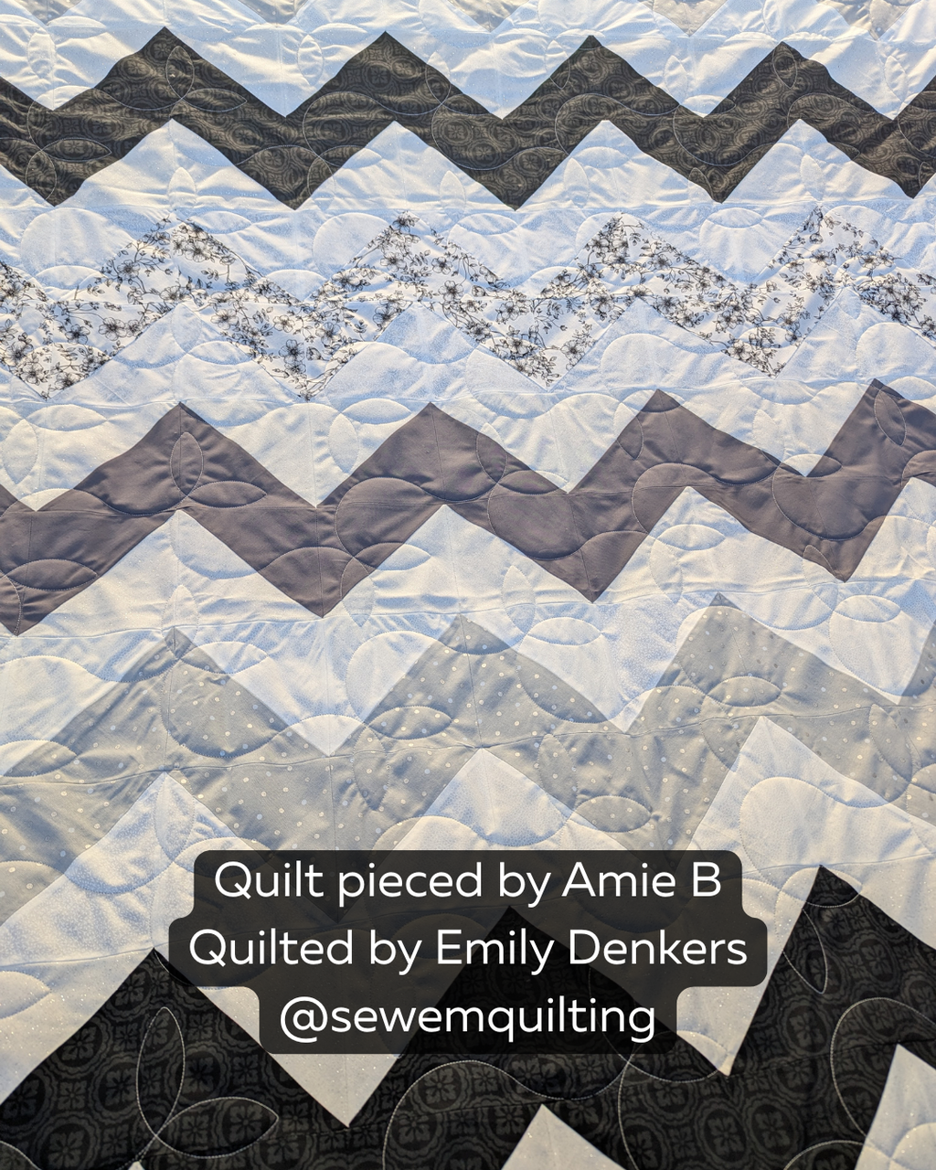 Black, gray, and white chevron quilt stitched with the Sprouting vine quilt pattern