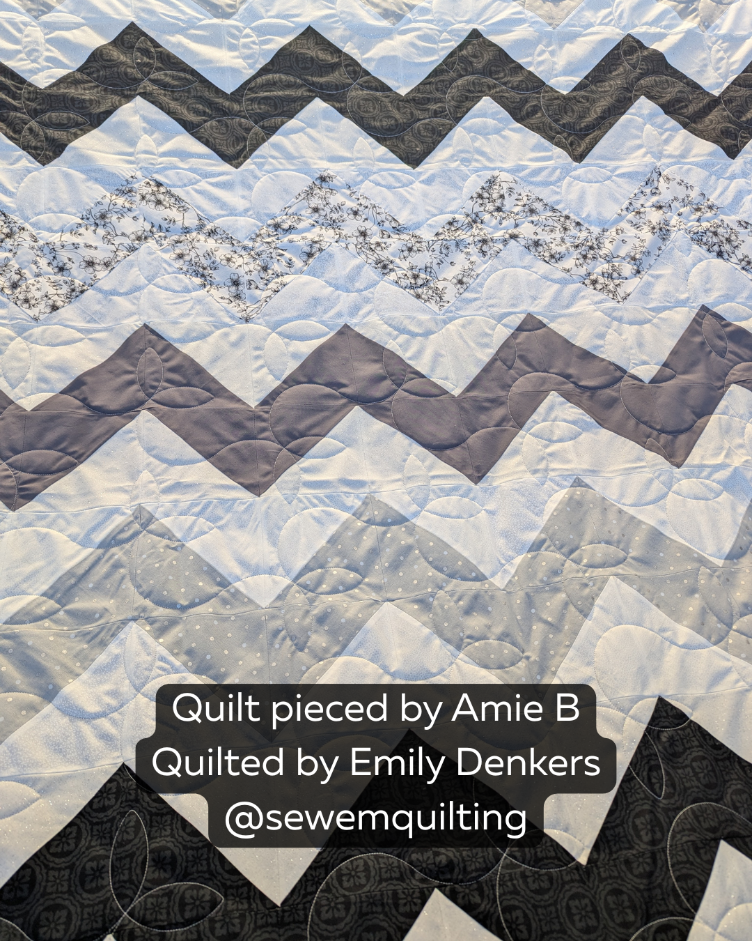 Black, gray, and white chevron quilt stitched with the Sprouting vine quilt pattern