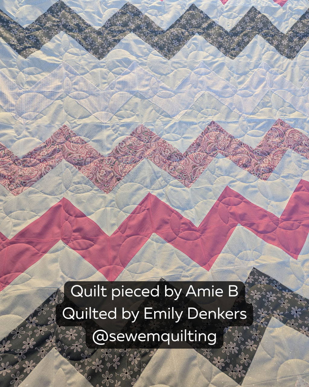 Pink, gray, and white chevron quilt stitched with the Sprouting vine quilt pattern