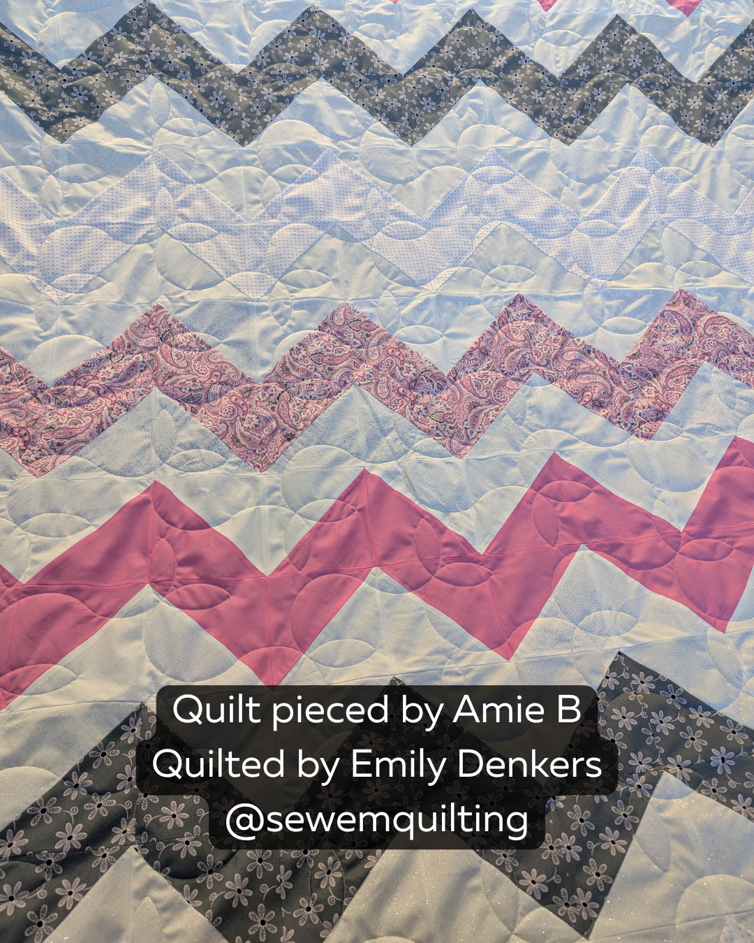 Pink, gray, and white chevron quilt stitched with the Sprouting vine quilt pattern