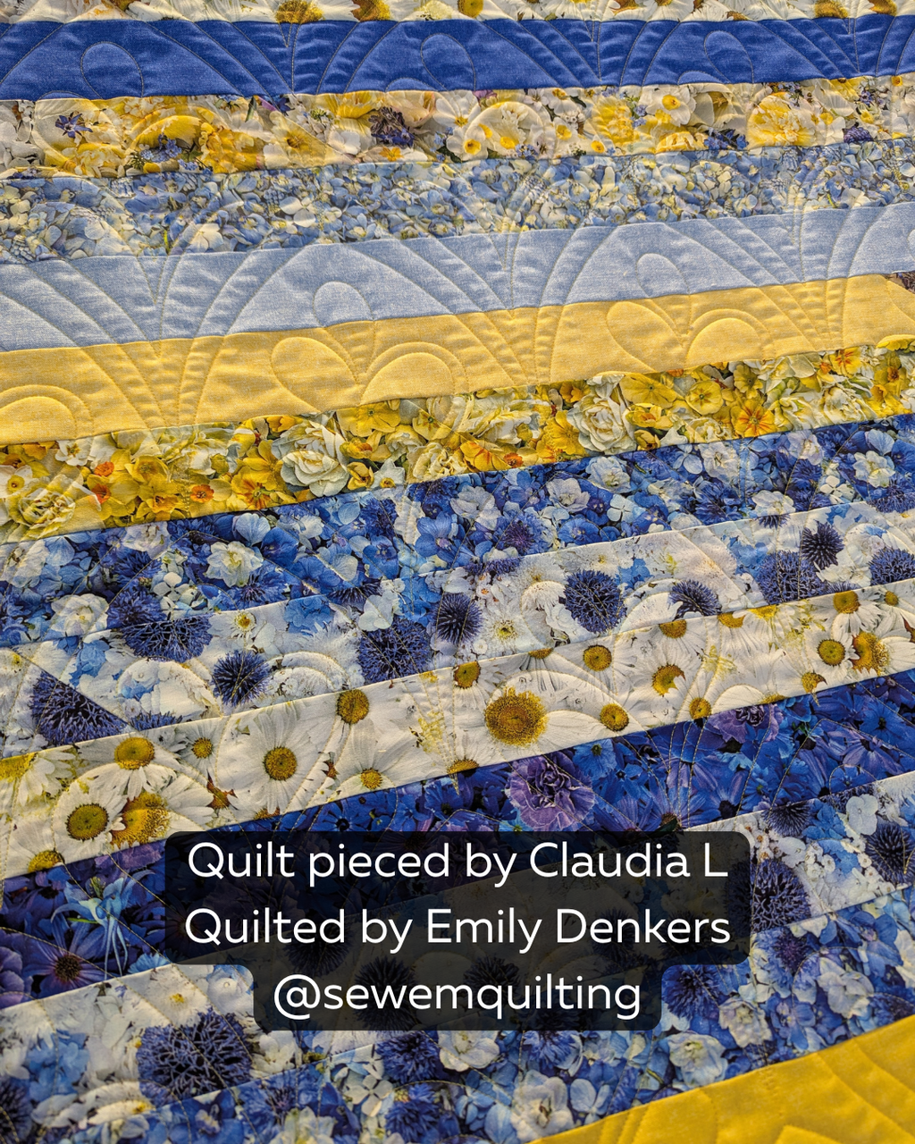 Floral strip quilt featuring vibrant blue, yellow, and white fabrics enhanced with the Succulent Fan Leaf digital pantograph for elegant flowing texture