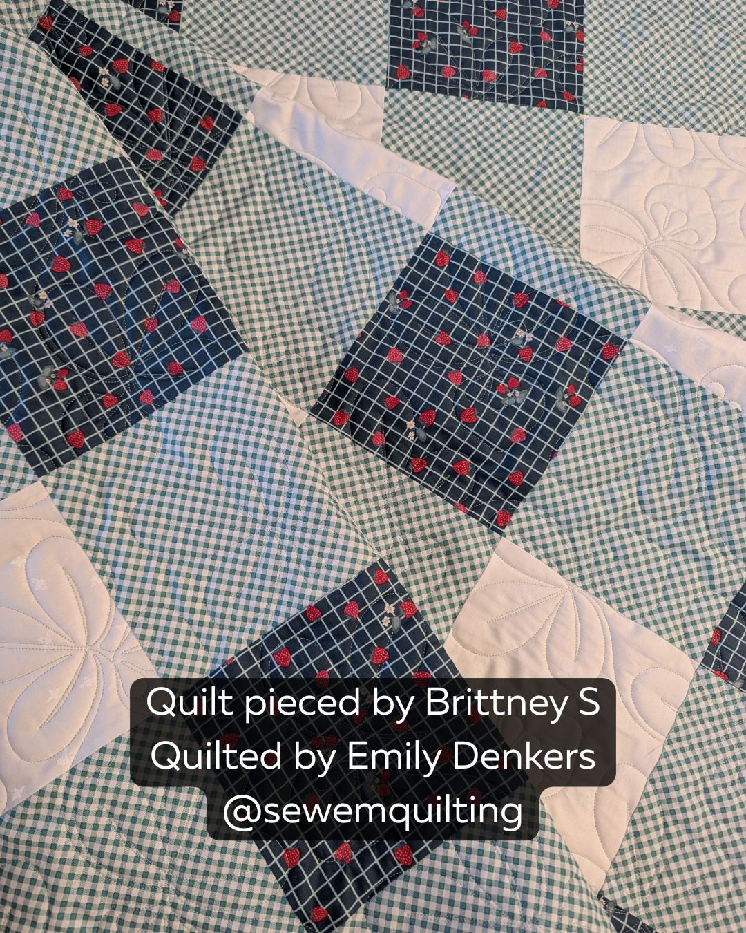 Fresh summer quilt featuring strawberry prints, gingham fabrics, and the Summer Strawberries fruit pantograph adding playful flowing texture throughout the design