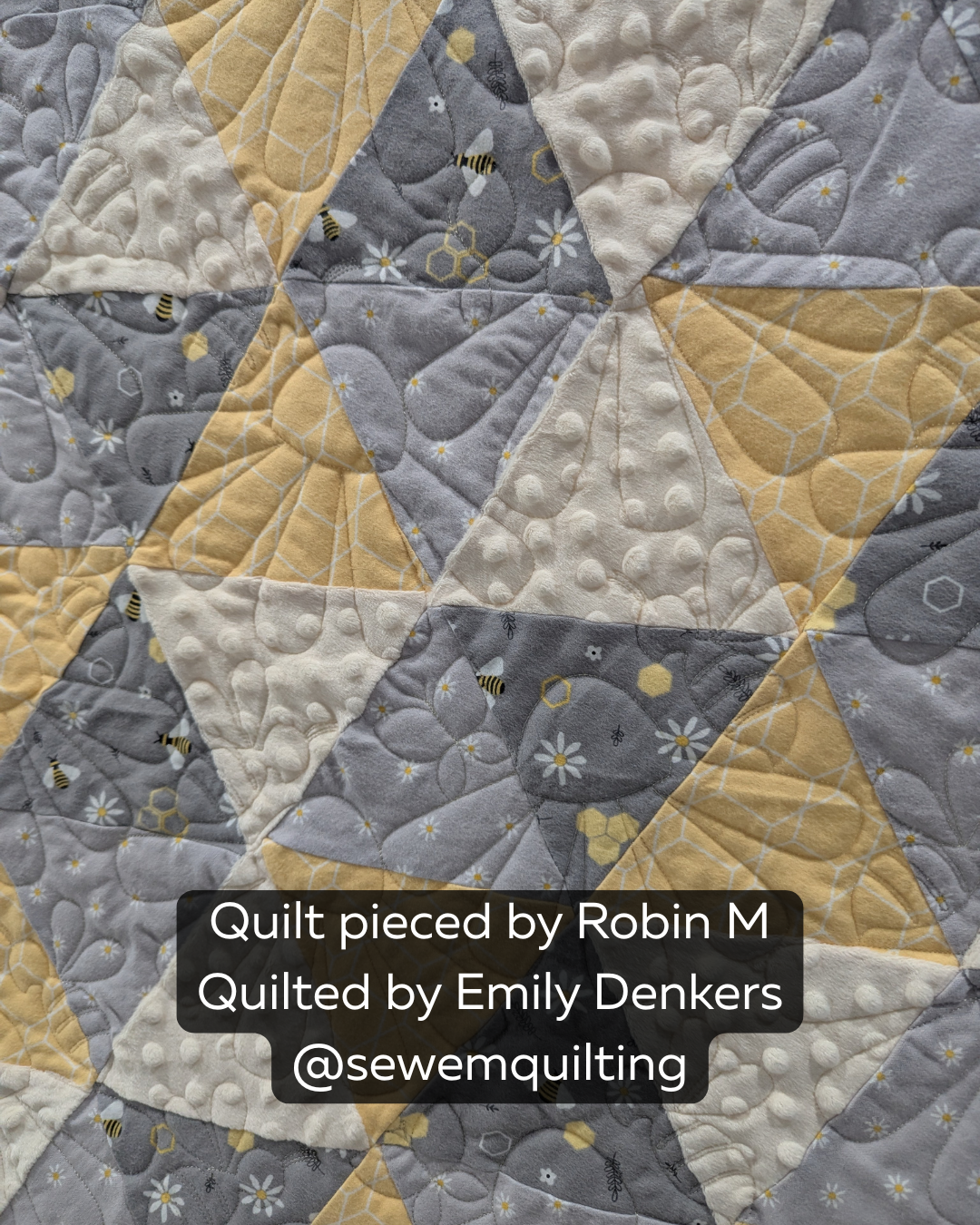 Modern bee-themed quilt featuring honeycomb-inspired fabrics and the Sweet As Can Bee edge-to-edge quilting design adding playful texture and movement