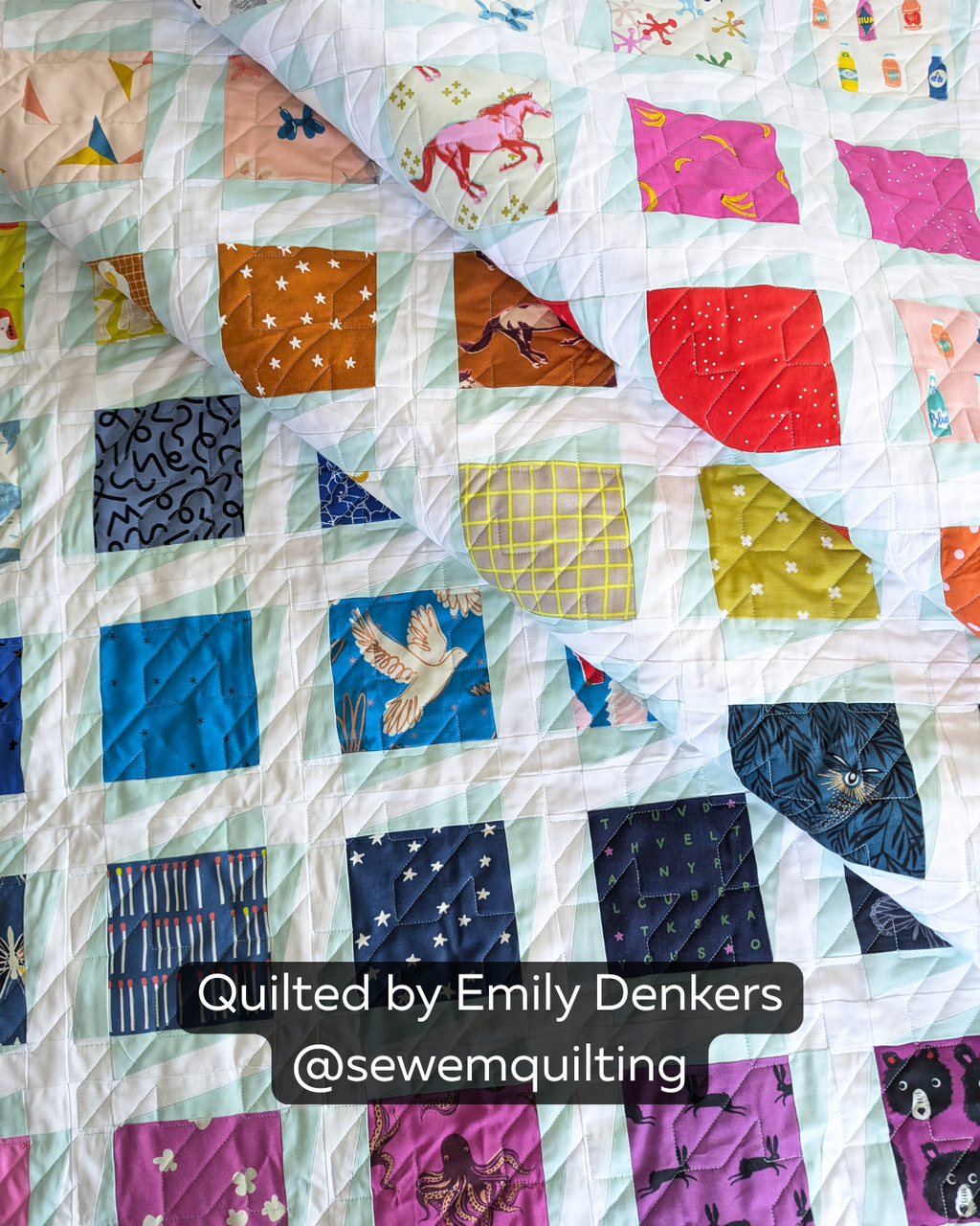 "Finished quilt example using the Traditional Houndstooth pantograph, showing angular geometric stitching on a colorful mint and white grid I-spy quilt with novelty prints, quilted by Emily Denkers @sewemquilting"