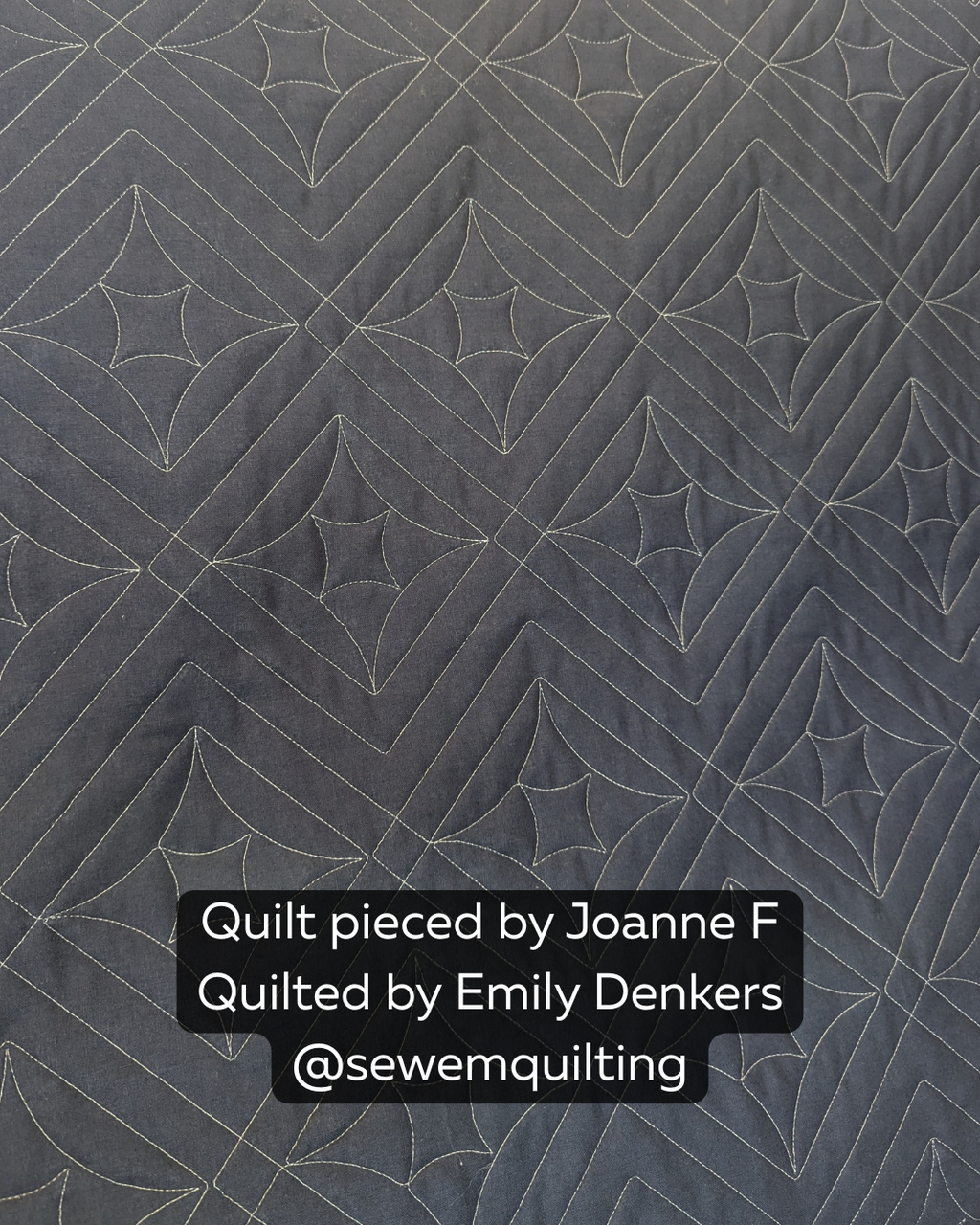 Minimalist quilt design with charcoal tones and crisp stitched details, showcasing the structured beauty of the Twinkle Plaid Star digital pantograph