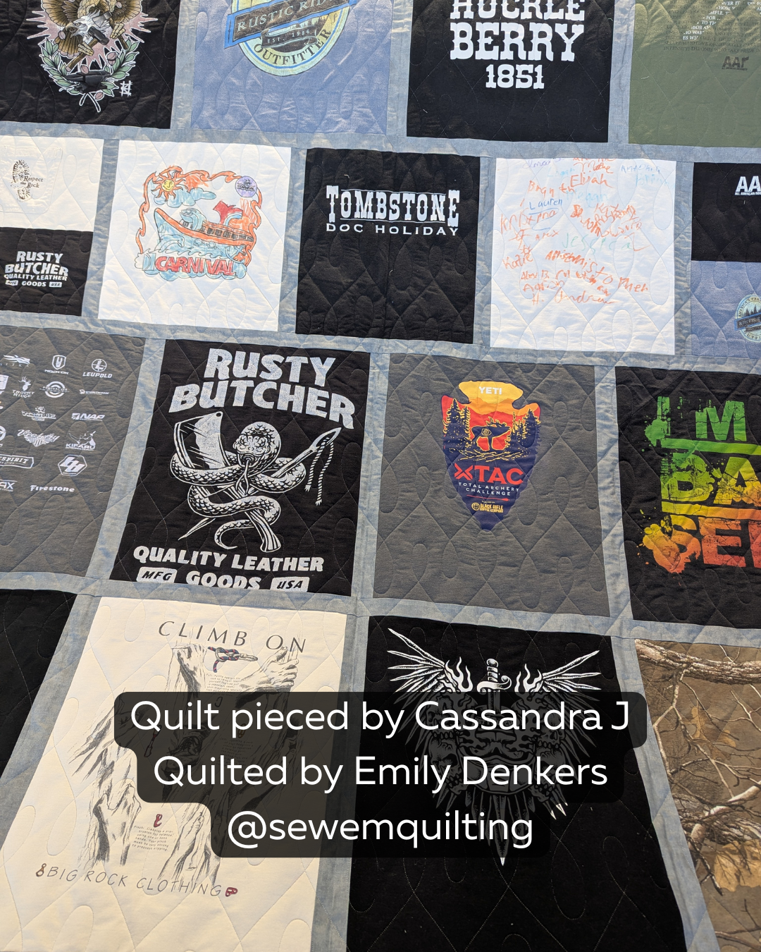 A cozy keepsake quilt showcasing vintage shirts and personal designs, enhanced with a graceful edge-to-edge quilting pattern of gentle loops and curves