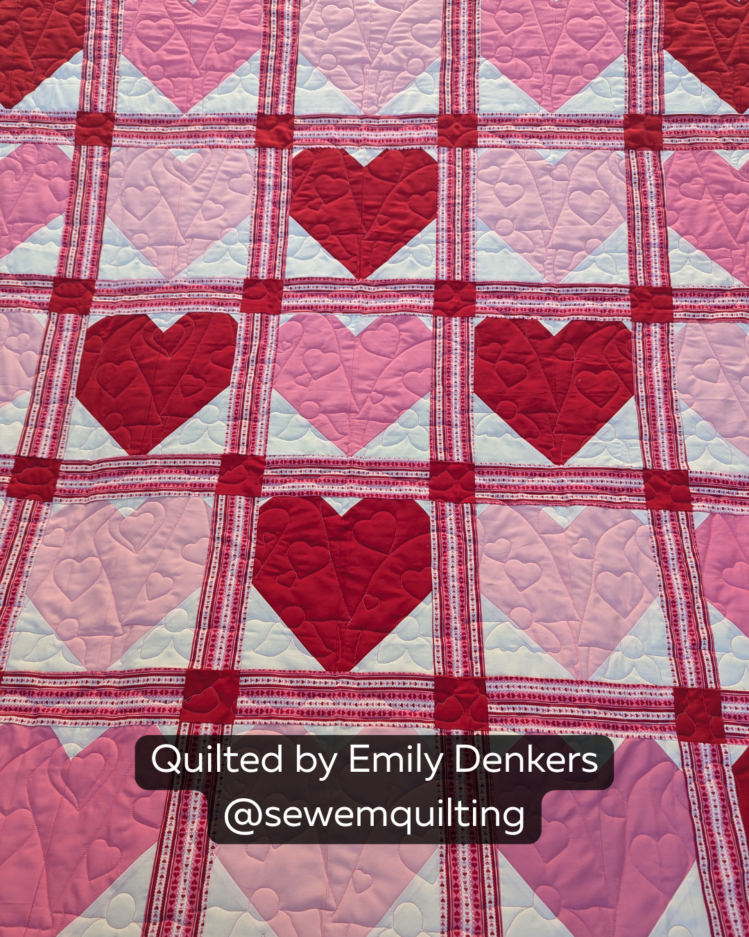 Red and pink heart quilt stitched with the Valentine Gnomes digital quilting pantograph